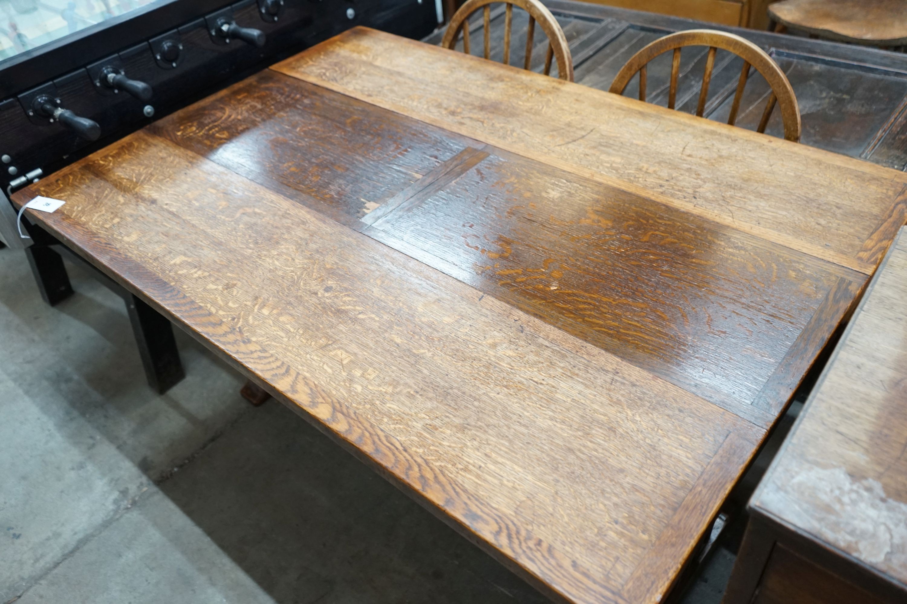 An 18th century style rectangular oak drop leaf extending dining table, depth 136cm, length 94cm extended, height 75cm